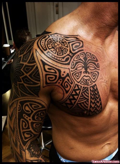 Black Ink Maori Sleeve And Chest Tattoo