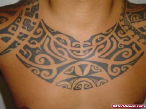 Attractive Black Ink Polynesian Chest Tattoo