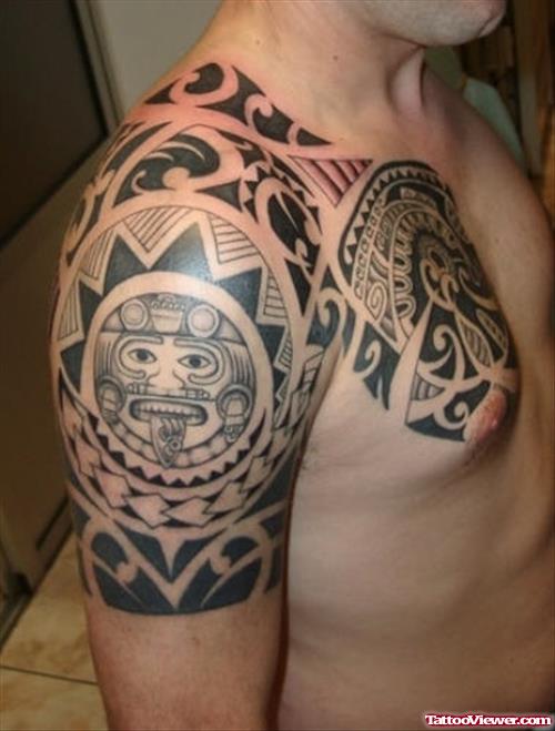 Black Ink Maori Shoulder And Chest Tattoo For Men