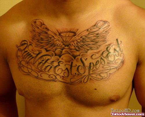 Grey Ink Angel Wings And Lettering Chest Tattoo