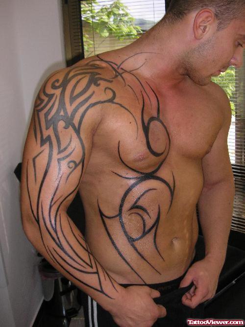 Sleeve And Chest Tribal Tattoo