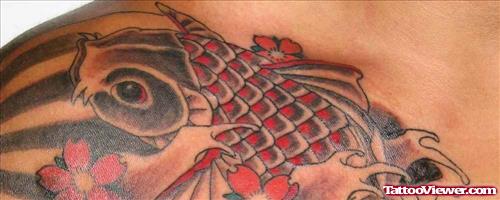 Koi Fish Colored Ink Chest Tattoo
