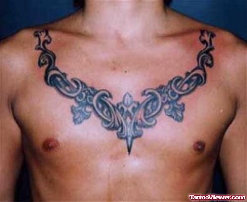 Grey Ink Masculine Tribal Chest Tattoo For Men
