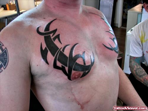 Black Ink Tribals Chest Tattoos