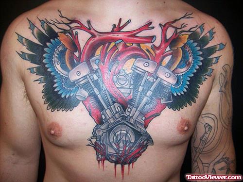 Human Heart And Colored Bike Machinery Chest Tattoo