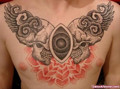 Grey Ink Winged Skulls Chest Tattoo