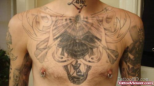Grey Ink Tribal And Skull Chest Tattoo