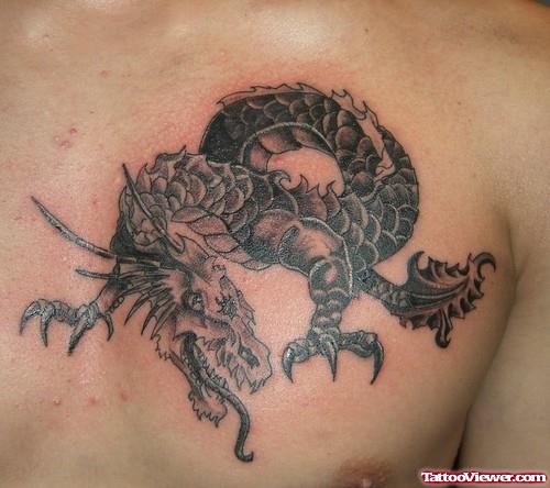 Grey Ink Dragon Chest Tattoo