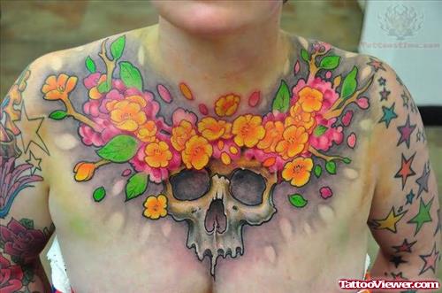 Skull And Color Flowers Tattoo On Chest