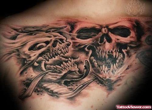 Grey Ink Skulls Tattoo On Chest