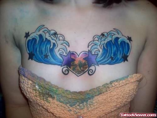 Wings And Heart Tattoo On Chest