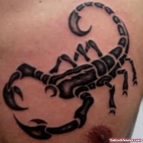 Black Ink Scorpion Tattoo On Chest
