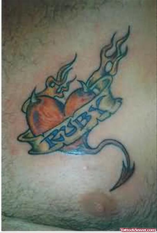 Flaming Heart Tattoo On Chest