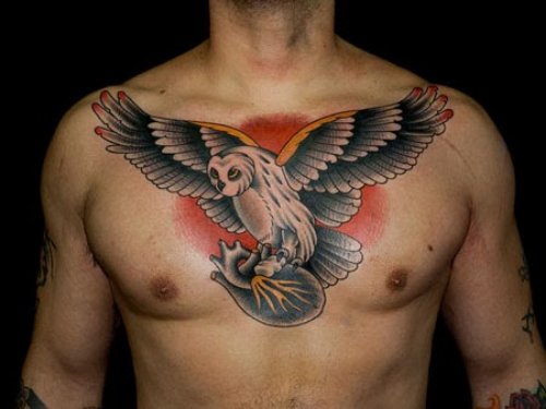 Owl Flying With Heart In Paws Chest Tattoo
