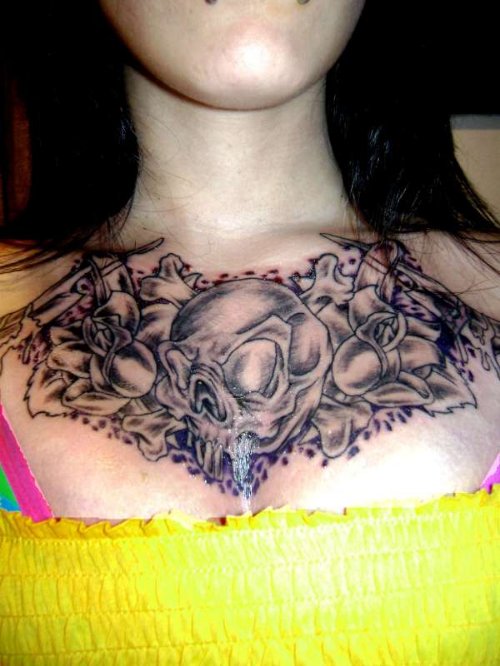 Grey Ink Skull And Flowers Chest Tattoo