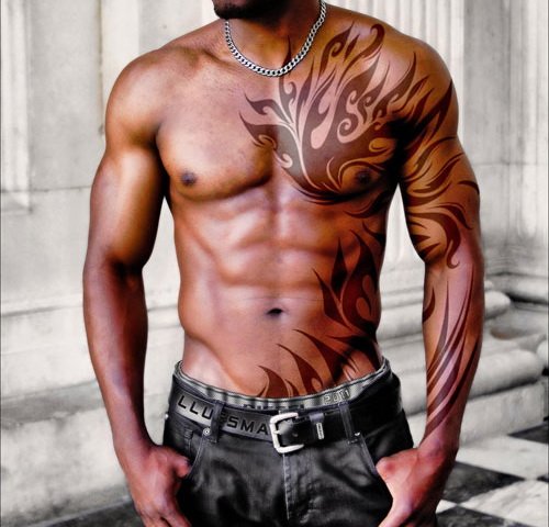 Cool Tribal Chest And Sleeve Tattoo