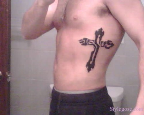 Black Ink Cross Christianity Tattoo On Left Side Rib