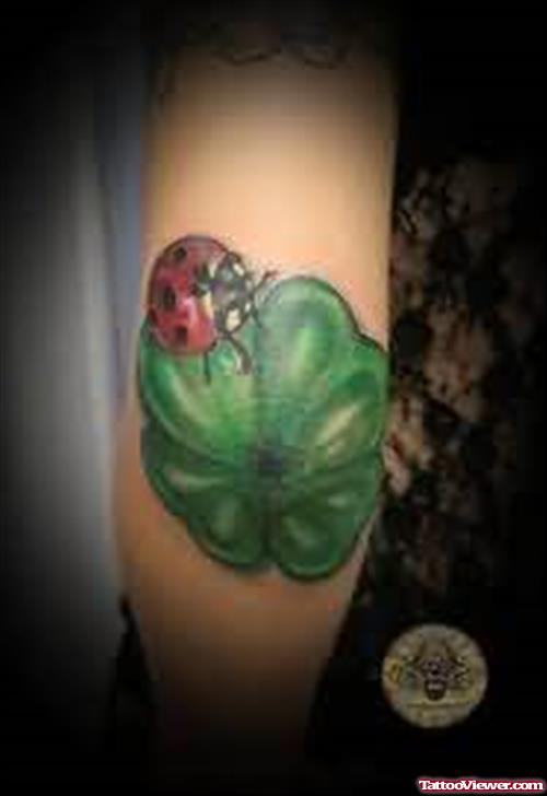 Lady Bug & Clover Tattoo On Elbow