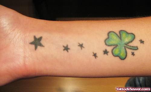 Stars And Clover Leaf Tattoo On Wrist