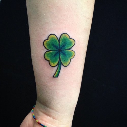 Amazing Green Ink Four Leaf Tattoo On Wrist