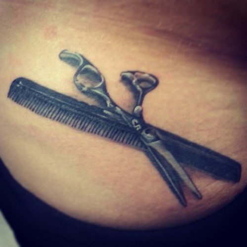 Comb And Scissor Tattoo On Lowerback