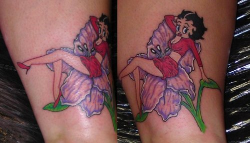 Betty Boop Sitting On Flower Tattoo