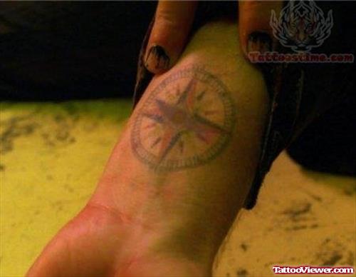 Red ink Compass Tattoo On Wrist