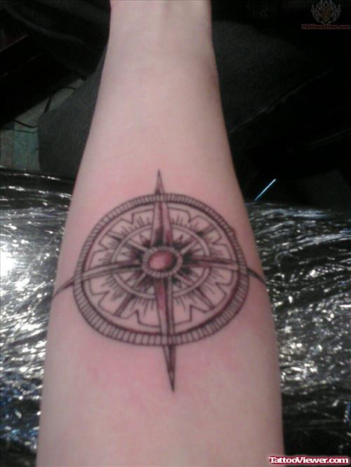 Grey Ink Compass Tattoo On Arm