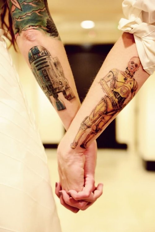 Attractive Couple Tattoos On Sleeve
