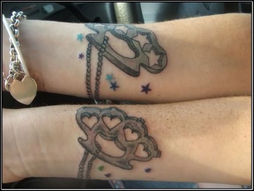 Grey Ink Knuckles Couple Tattoo On Sleeve