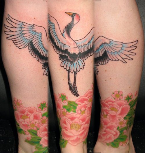 Pink Flowers And Crane Tattoo On Sleeve