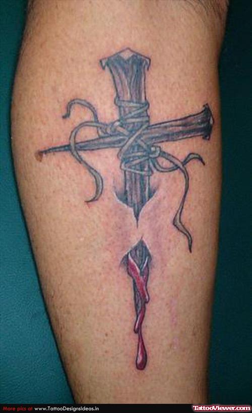 Ripped Skin Cross Tattoo On Leg