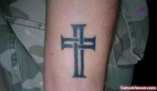 Black Ink Small Cross Tattoo On Arm