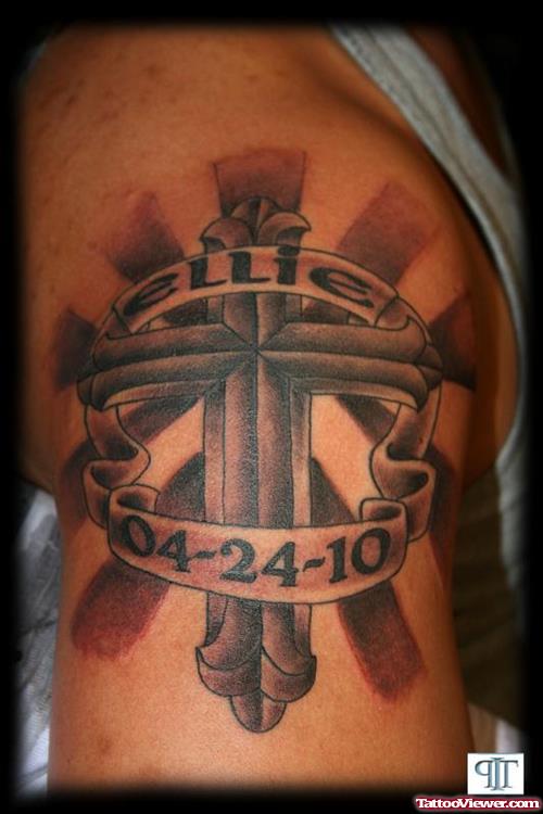 Grey Ink Cross With Memorial Banner Tattoo On Shoulder