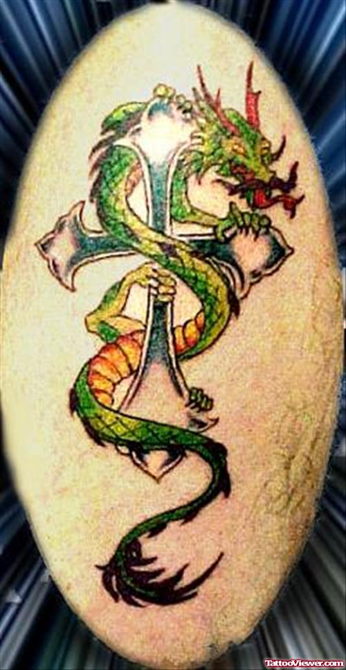 Green Ink Dragon And Cross Tattoo