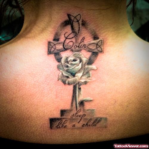 Feminine Cross Tattoo On Upperback