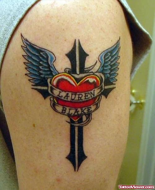Winged Cross And Heart Tattoo On Left Shoulder