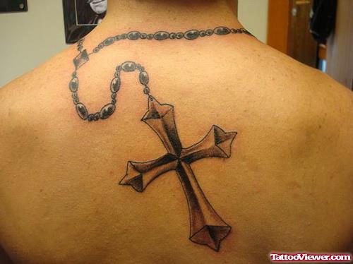 Rosary Cross Tattoo On Man Upperback