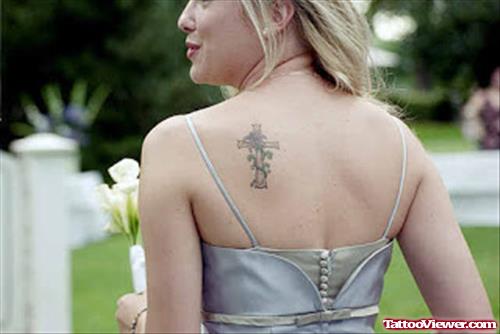 Grey Ink Cross Tattoo On Left Back Shoulder