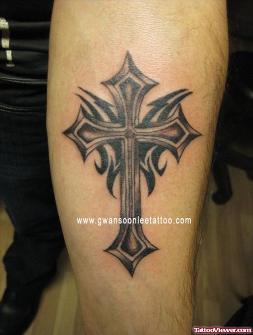 Left Arm Cross And Tribal Tattoo