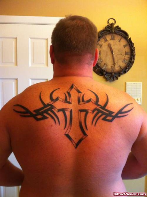 Tribal And Cross Tattoo On Man Upperback