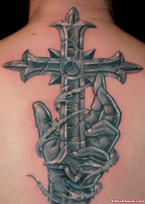 Grey Ink Hand And Cross Tattoo On Upperback