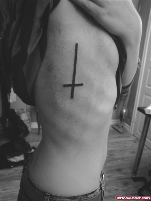 Black Ink Cross Tattoo On Side Rib