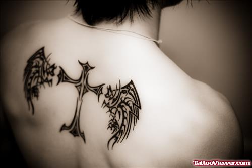 Winged Cross Tattoo On Man Upperback