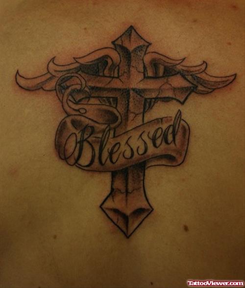 Grey Ink Winged Cross With Blessed Banner Tattoo