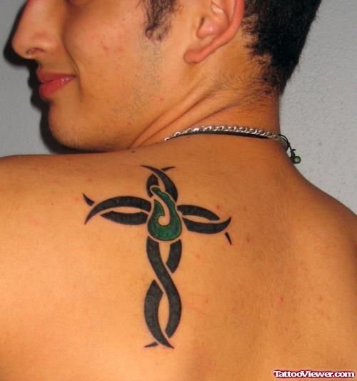 Black Ink Tribal Cross Tattoo On Left BAck Shoulder