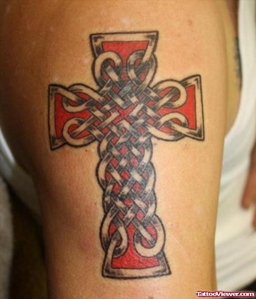 Red Ink Celtic Cross Tattoo On Left Shoulder
