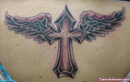 Grey Ink winged Cross Tattoo On Upperback