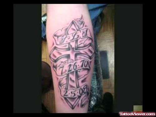 Grey Ink Memorial Cross Tattoo On Arm