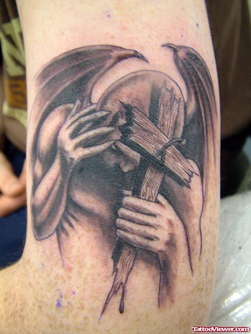Devil With Cross In Hand Grey Ink Tattoo On Bicep